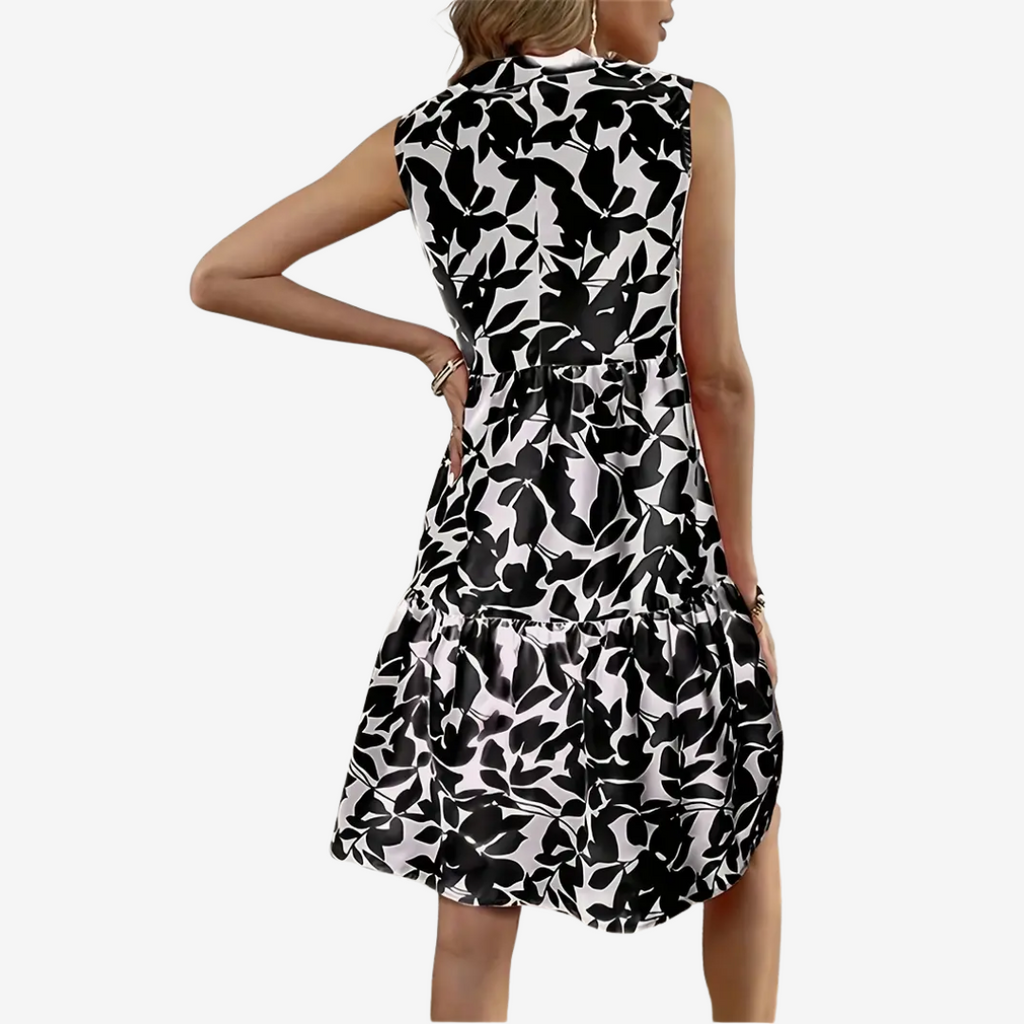 Daphne | robe midi élégante, coupe évasée, détails floraux.