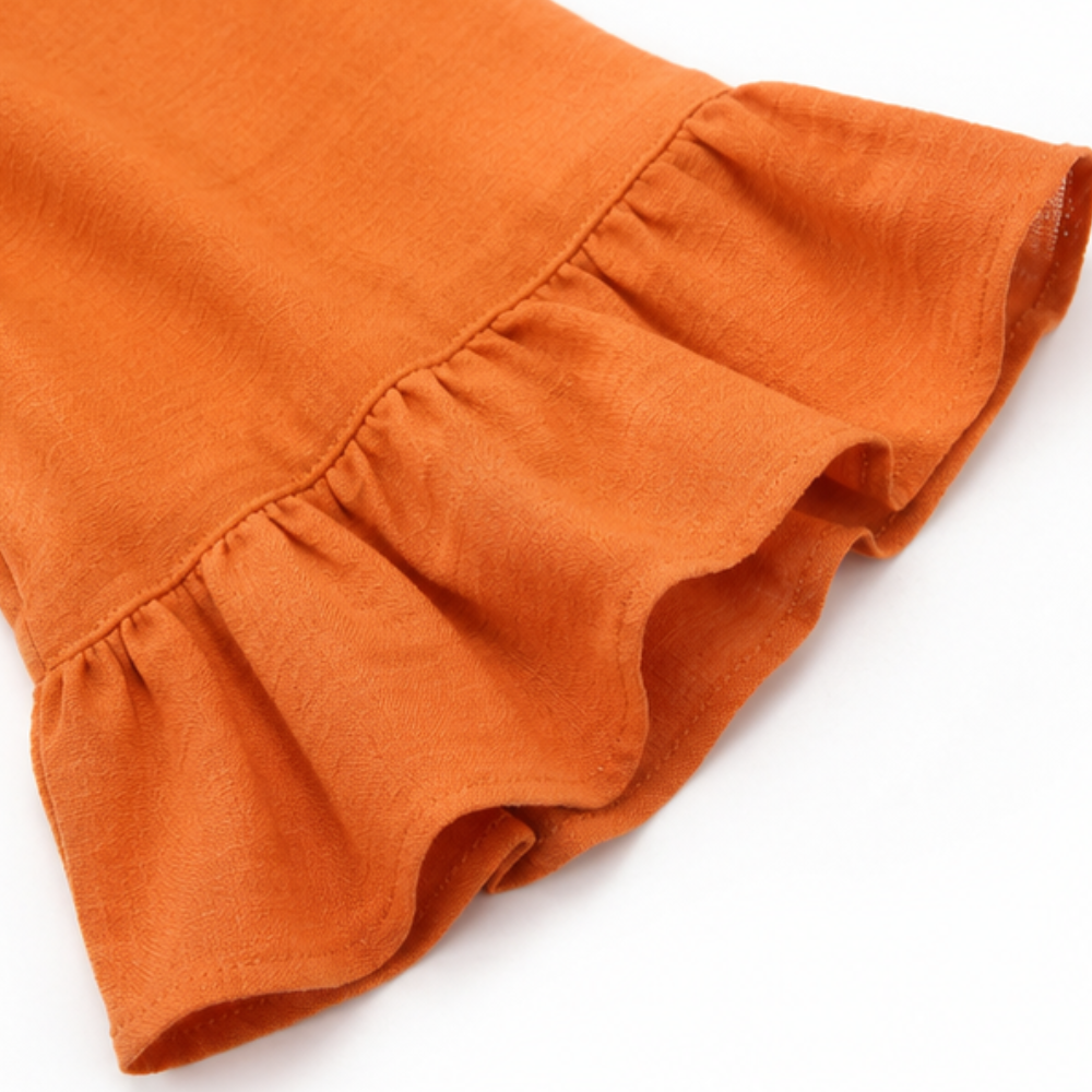 Laurelle – Blouse à manches volantées et décolleté en V avec boutons