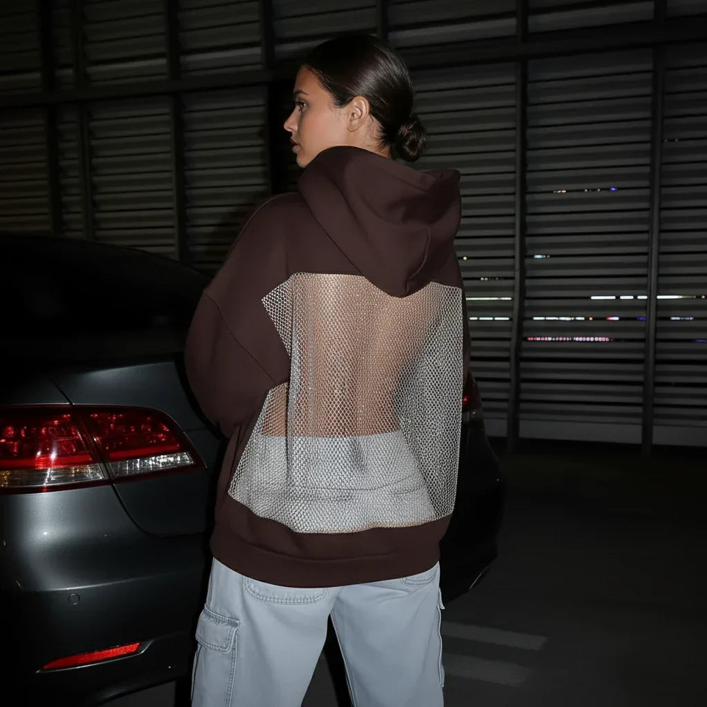 BackStageGlow | Quand les lumières s'allument, ce sweat à capuche ne brille pas seulement, il domine l'espace