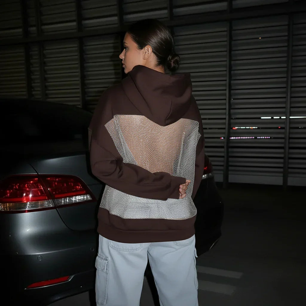 BackStageGlow | Quand les lumières s'allument, ce sweat à capuche ne brille pas seulement, il domine l'espace