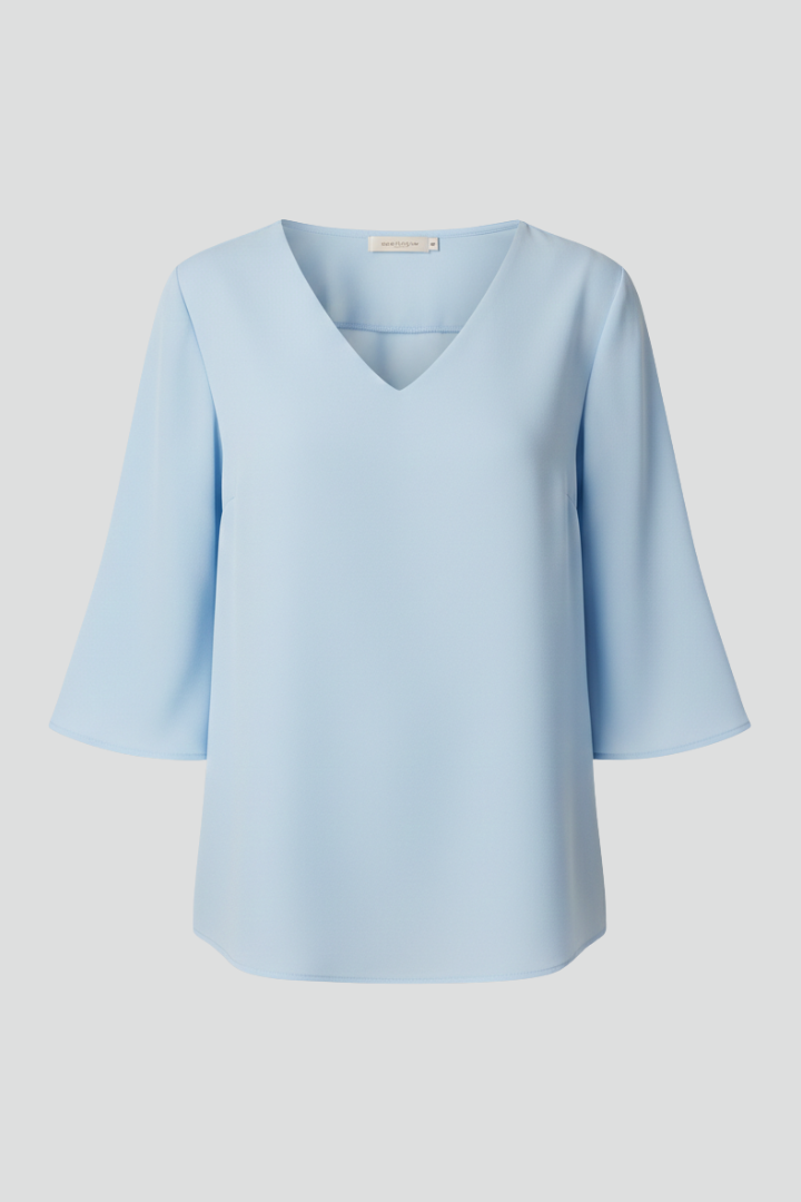 Blouse pour femmes avec décolleté en V et manches trois-quarts