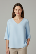 Blouse pour femmes avec décolleté en V et manches trois-quarts