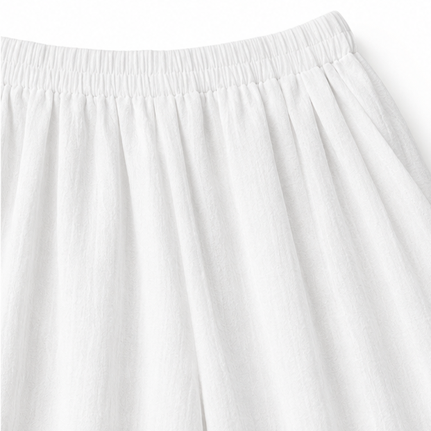 Elovena – Ensemble assorti à ourlet asymétrique avec pantalons à jambes larges